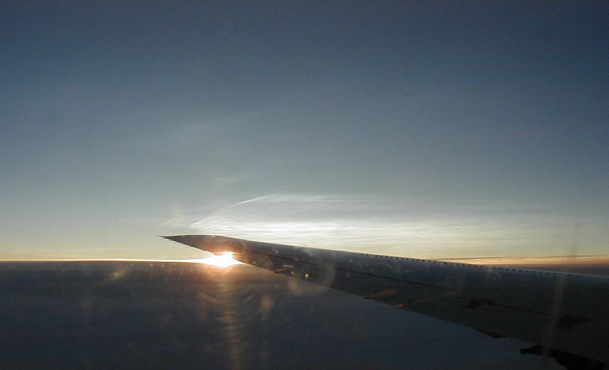 A olar stratospheric clouds observed out thewindowof the NASA DC-8 upon as we circled Kiruna Sweden on November 30, 1999.The PSC's areseen as white "cirrus" like clouds above the wing.  These clouds were wellabove the tropopause (~ 8 km) and the aircraft (~12 km) which was in thelower stratosphere.  The PSC's  were predicted by mountain wave forecastsfor the region south of Kiruna.  The DC-8 was transiting to Kiruna for thefirst segment of the joint SOLVE - THESO-2000 mission.